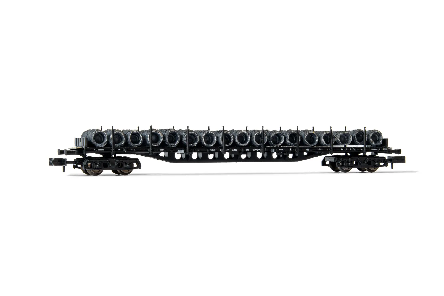 DB, 4-axle flat wagon with stakes Sgjs 716, black livery, loaded with wire coils, period IV
