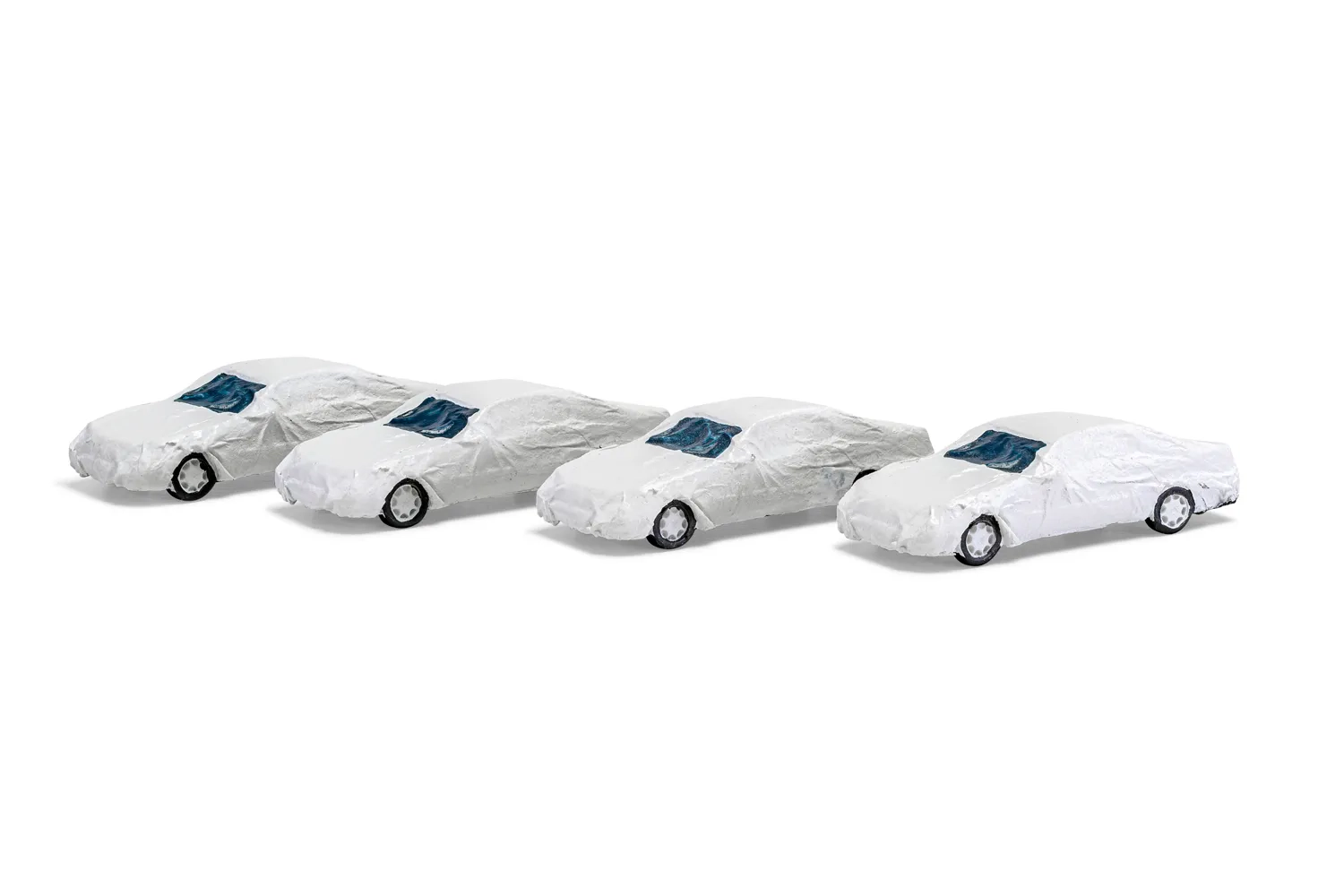 Load: 4 luxury class cars with white transport cover