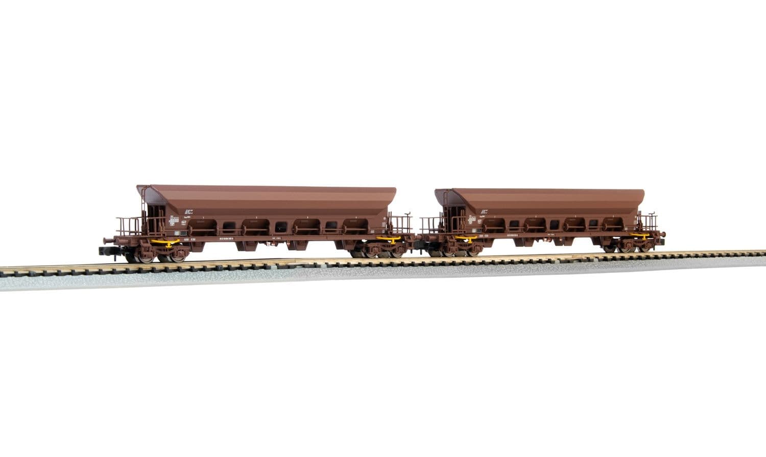 DR, 2-unit set 4-axle hopper wagons Facs, brown livery, loaded with brown coal, period IV