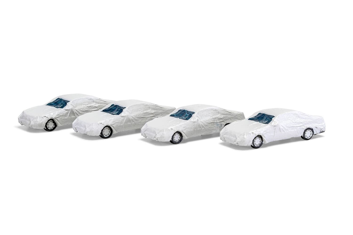 Load: 4 luxury class cars with white transport cover