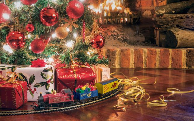 train set around christmas tree