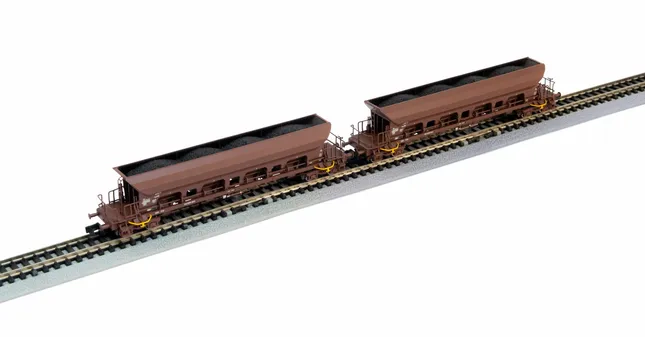 DR, 2-unit set 4-axle hopper wagons Facs, brown livery, loaded with brown coal, period IV