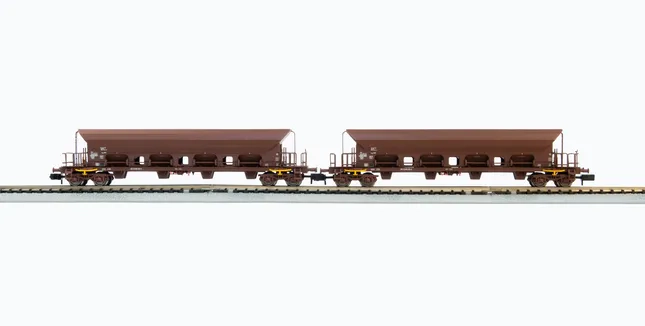 DR, 2-unit set 4-axle hopper wagons Facs, brown livery, loaded with brown coal, period IV