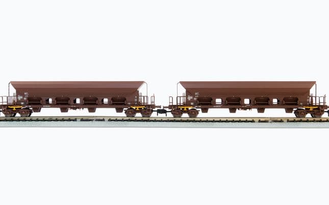 DR, 2-unit set 4-axle hopper wagons Facs, brown livery, loaded with brown coal, period IV