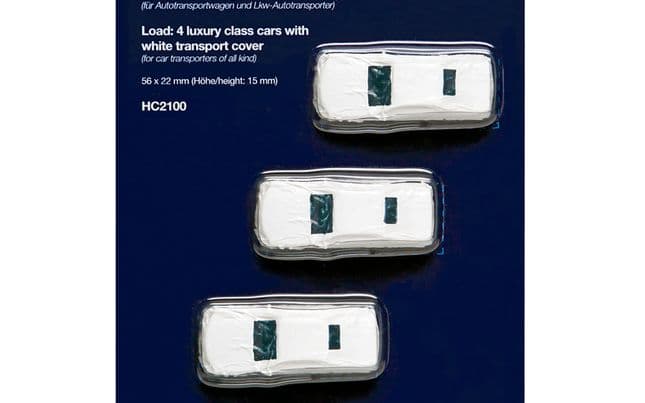 Load: 4 luxury class cars with white transport cover